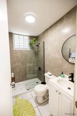 Modern bathroom with hot water and all essentials.