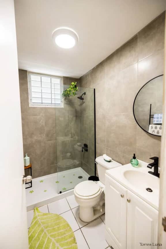 Modern bathroom with hot water and all essentials.